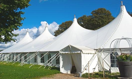 high-quality portable restrooms stationed at a wedding, meeting the needs of guests throughout the outdoor reception in East Alton